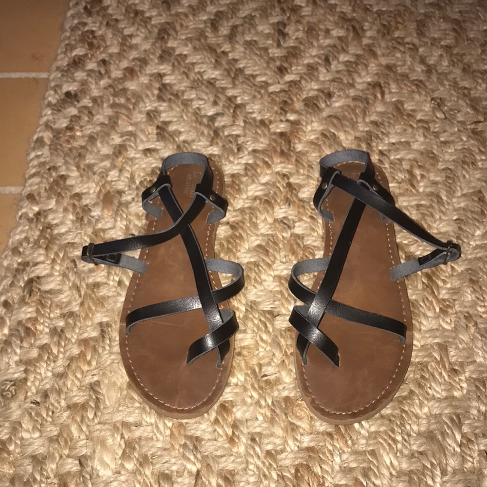 Black strapped sandals.